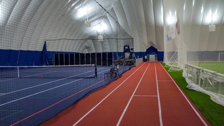 Small interior photo of The Farley Group's Russel Township Sports Dome in Ontario with net dividers separating 2 fields.